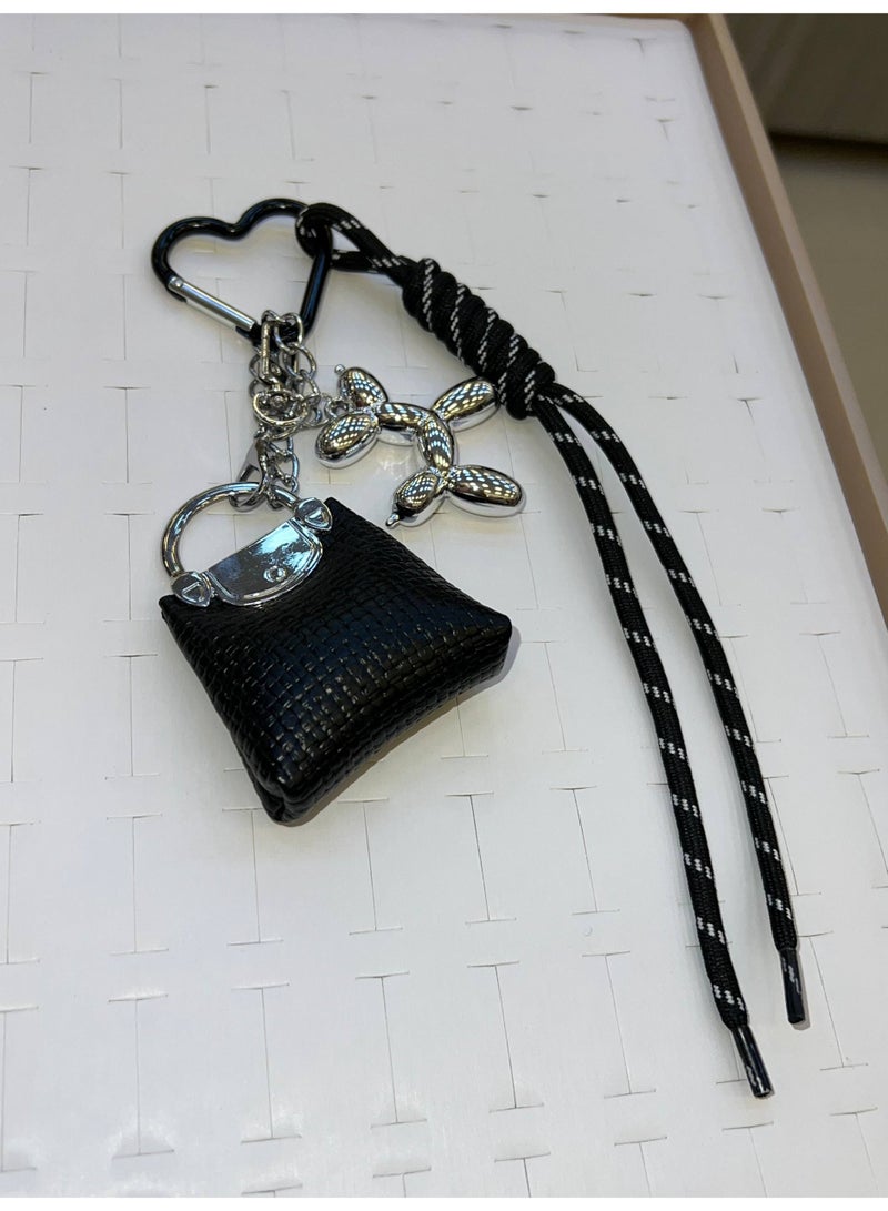 A stylish heart-shaped bag and keychains in assorted colors - Image 4